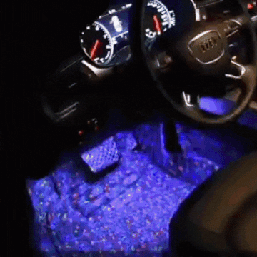 ForKumi car LED interior lights kit illuminating car footwell with blue light under steering wheel