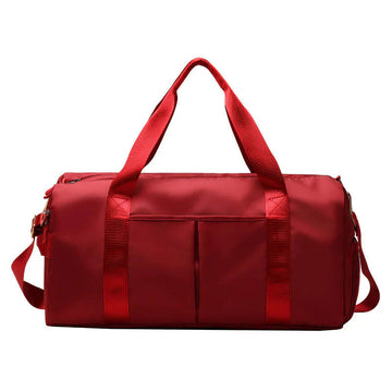 ForKumi red waterproof gym duffel bag with multiple pockets and sturdy handles