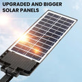 ForKumi 150W solar motion light outdoor with upgraded bigger solar panels under clear blue sky