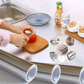 ForKumi aluminum foil kitchen sticker applied on kitchen countertop with hands cutting tomato on a wooden board