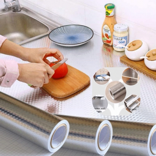 ForKumi aluminum foil kitchen sticker applied on kitchen countertop with hands cutting tomato on a wooden board