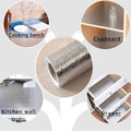 ForKumi aluminum foil kitchen sticker roll with application examples on cooking bench, cupboard, kitchen wall, and drawer