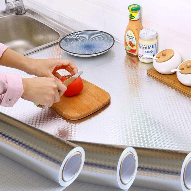 ForKumi aluminum foil kitchen sticker covering countertop with person slicing tomato on wooden board