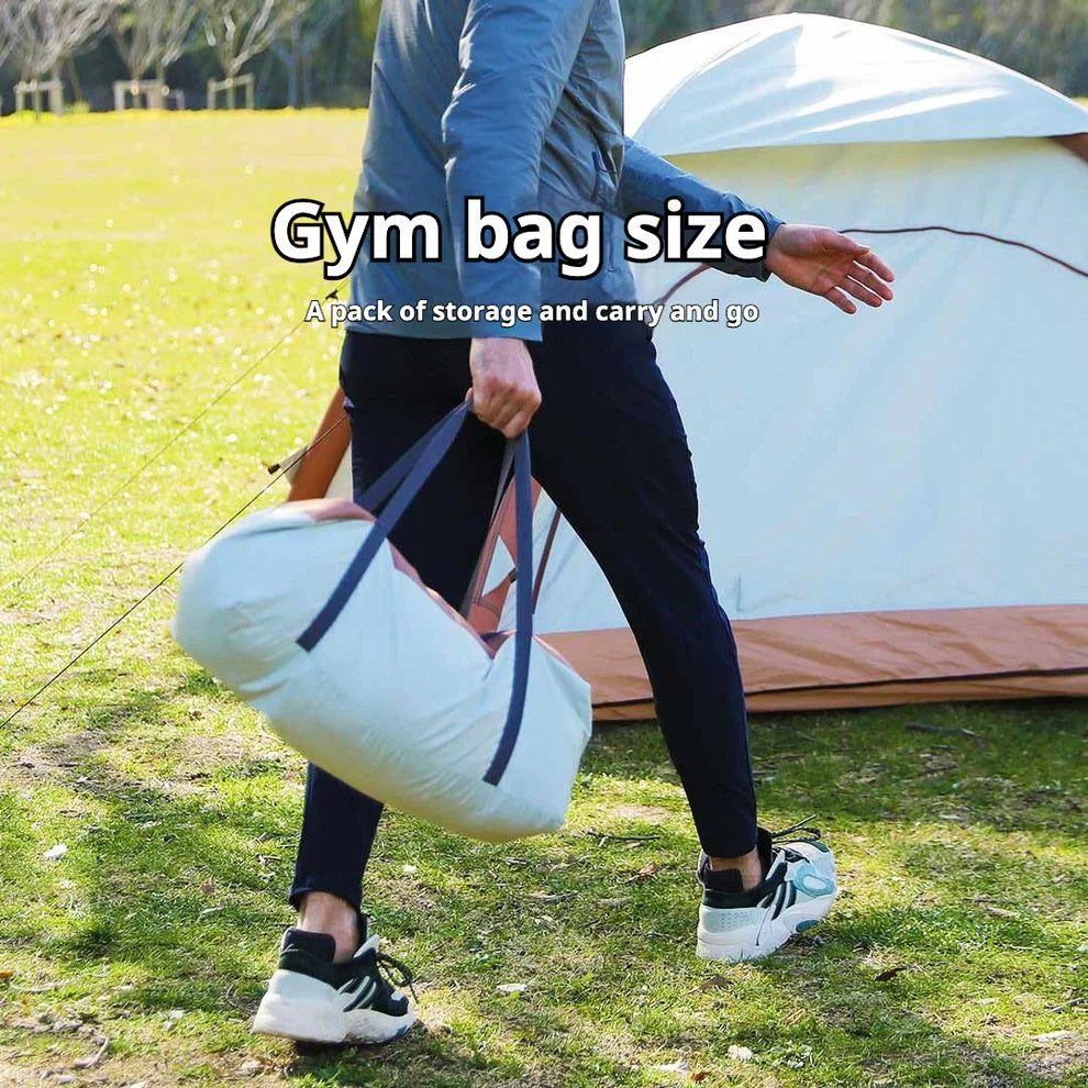 ForKumi automatic inflatable camping tent with double doors and spacious interior on green grass