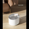 ForKumi classic white automatic pet water fountain placed on wooden floor near brown sofa