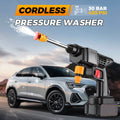 ForKumi cordless pressure washer spraying water in front of a silver SUV for car cleaning