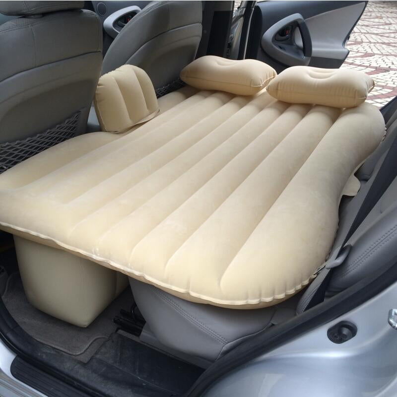 ForKumi beige car air mattress with pump inflated on backseat with pillows for comfortable travel