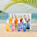 ForKumi warm gourmand perfume mist set with colorful bottles displayed on beach background