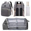 Gray ForKumi diaper backpack for travel with multiple compartments and portable foldable crib