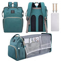 ForKumi diaper backpack for travel in teal with multiple compartments and portable baby bed feature