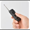ForKumi remote control for smart dog training collar held in hand with extendable antenna