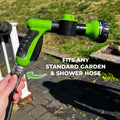 ForKumi dog bathing sprayer with multiple modes in green and black attached to garden hose
