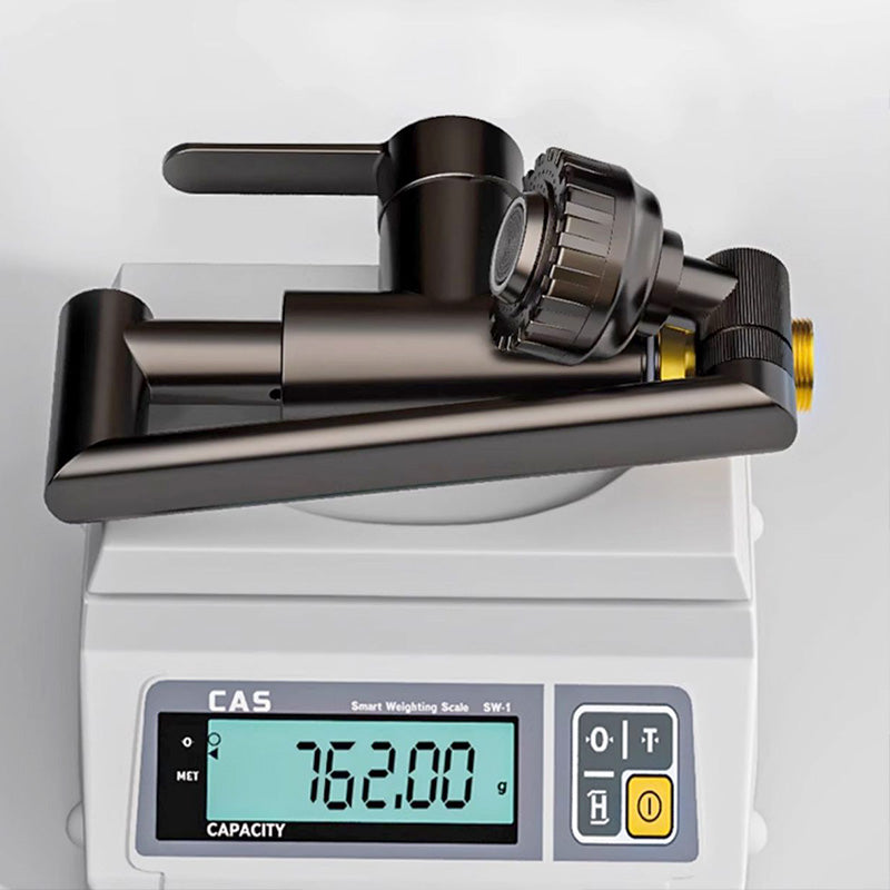 ForKumi dual temperature kitchen faucet in matte black placed on a digital weighing scale showing 762 grams