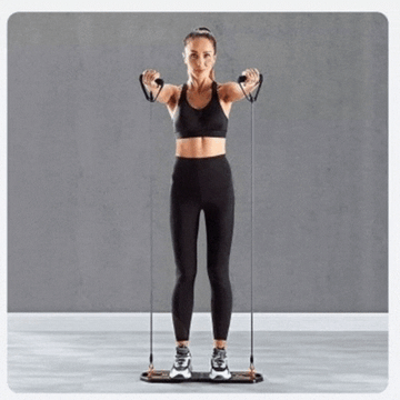 Woman exercising with ForKumi foldable pushup board set using resistance bands in black workout outfit