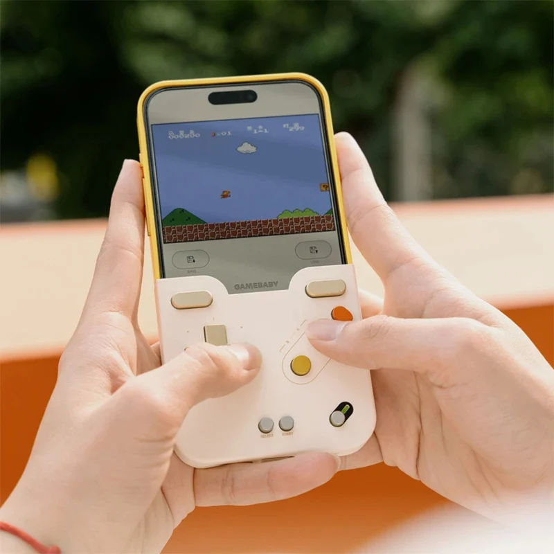 Hands holding an iPhone 16 Pro Max gaming case with retro game controller design playing a pixelated game