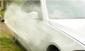 ForKumi 1400W electric pressure washer cleaning a white car exterior with strong water spray