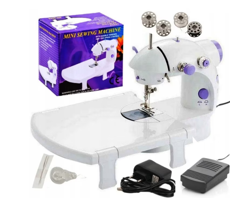 ForKumi 4-in-1 mini sewing machine with accessories including bobbins, foot pedal, and adapter in white