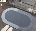 ForKumi quick dry bath mat in gray with HOME text perfect for bathroom use