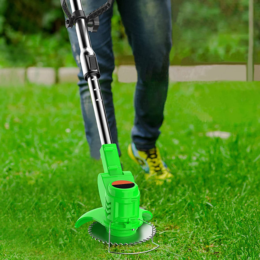 ForKumi cordless adjustable lawn mower with green handle and metal shaft next to included tools and accessories