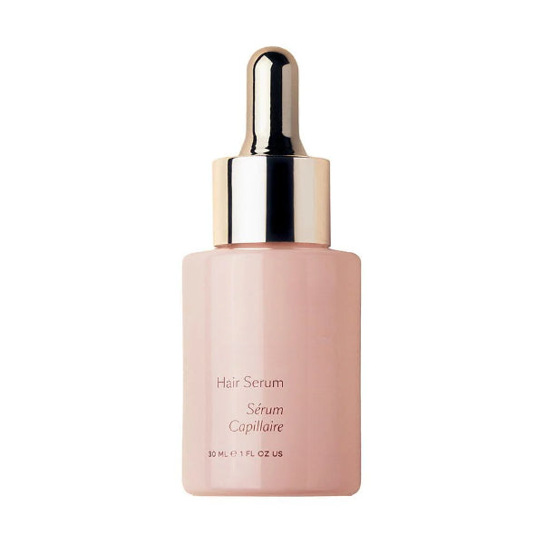 ForKumi hair serum for shiny hair in a pink bottle with gold dropper cap