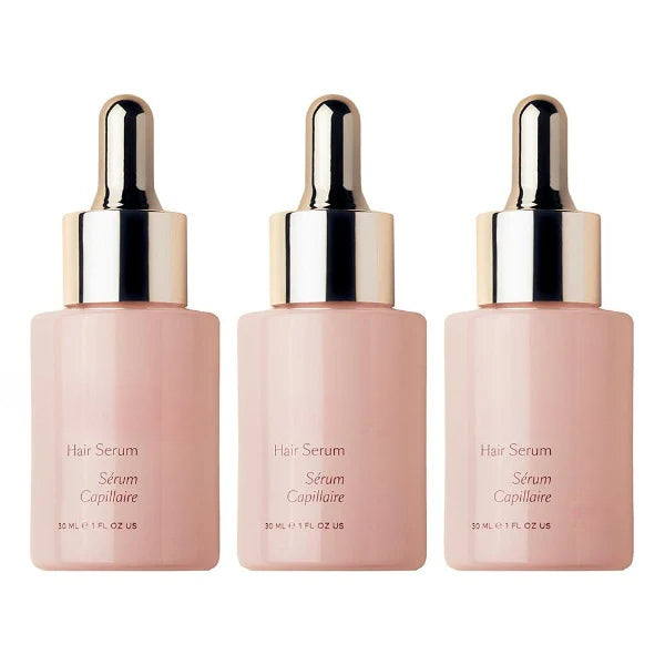 ForKumi hair serum for shiny hair in three pink dropper bottles for healthy glossy hair