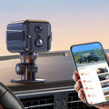 ForKumi HD WiFi security camera mounted inside a car with phone showing live remote surveillance feed