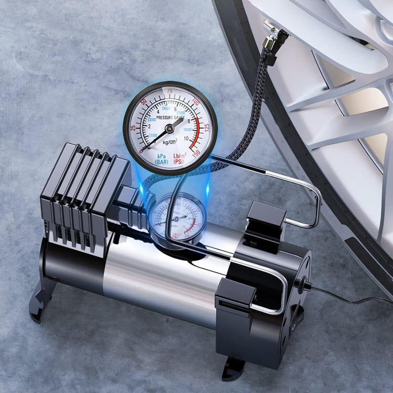 Avis high-pressure tire inflator connected to car tire with pressure gauge on gray background