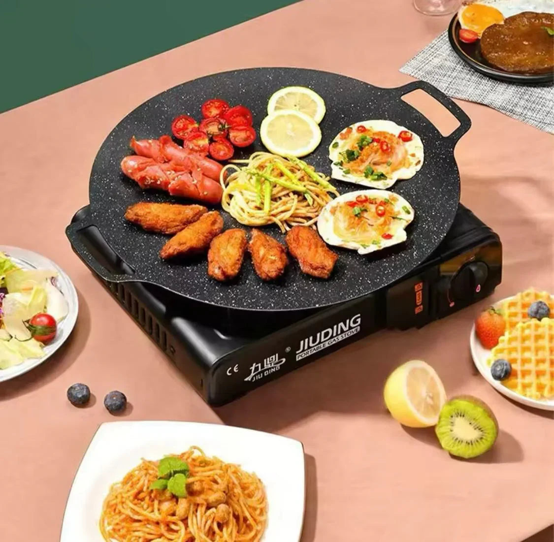 ForKumi 30cm Japanese nonstick skillet cooking assorted grilled foods on a portable electric stove