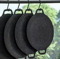 ForKumi 30cm Japanese nonstick skillet hanging in a row with black speckled surface and handle hooks