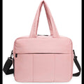 ForKumi lightweight gym duffle bag 40L in pink with multiple carrying options and front pocket