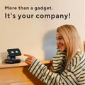 ForKumi LOOI  Smart AI Companion Robot on wood dresser with smiling woman pointing and interacting
