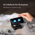 LOOI  Smart AI Companion Robot phone dock with animated blue eyes on screen on compact robot base