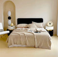ForKumi luxury reversible bed blanket in beige ribbed texture on modern bed with matching pillows