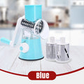 ForKumi blue manual rotary grater with interchangeable stainless steel blades on white wooden surface