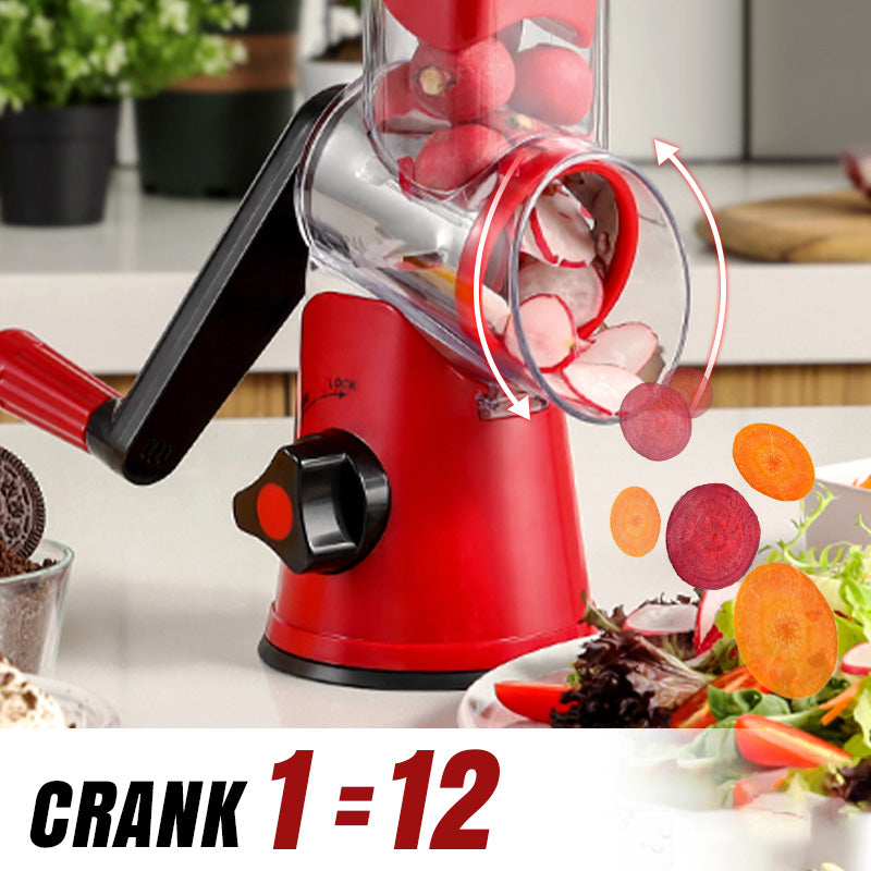 ForKumi red manual rotary grater slicing vegetables with a hand crank on a kitchen countertop