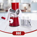 ForKumi red manual rotary grater with interchangeable stainless steel drum attachments on white wooden surface