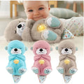 Avis musical otter soother for babies in blue pink and gray plush designs with baby holding a gray one