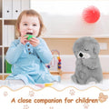 Musical otter soother for babies plush toy next to a toddler playing with a green cup