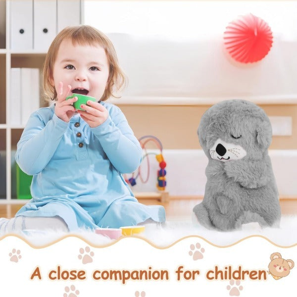 Musical otter soother for babies plush toy next to a toddler playing with a green cup