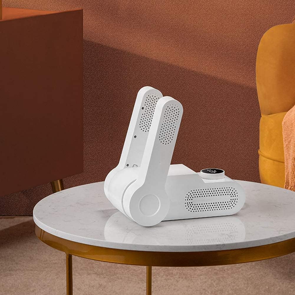 ForKumi odor eliminating shoe dryer for home in white placed on a round marble table