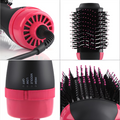 ForKumi 1000W hot air brush styler with black and pink bristles and adjustable heat settings