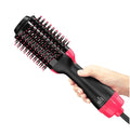 ForKumi 1000W hot air brush styler in black and pink held in hand for hair styling