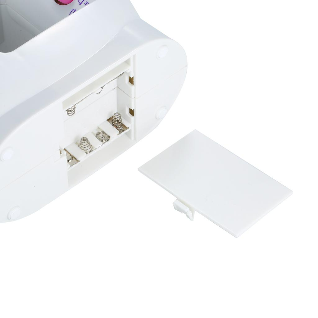 Battery compartment with cover removed on ForKumi portable 4-in-1 sewing machine in white