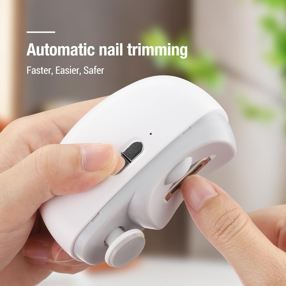 ForKumi white portable nail clipper with automatic nail trimming held in hand for easy use