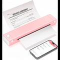 Pink portable thermal printer printing a services agreement document with smartphone nearby