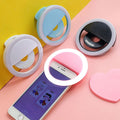 ForKumi pro selfie ring light clip-on for smartphones in pink, white, blue, and black colors