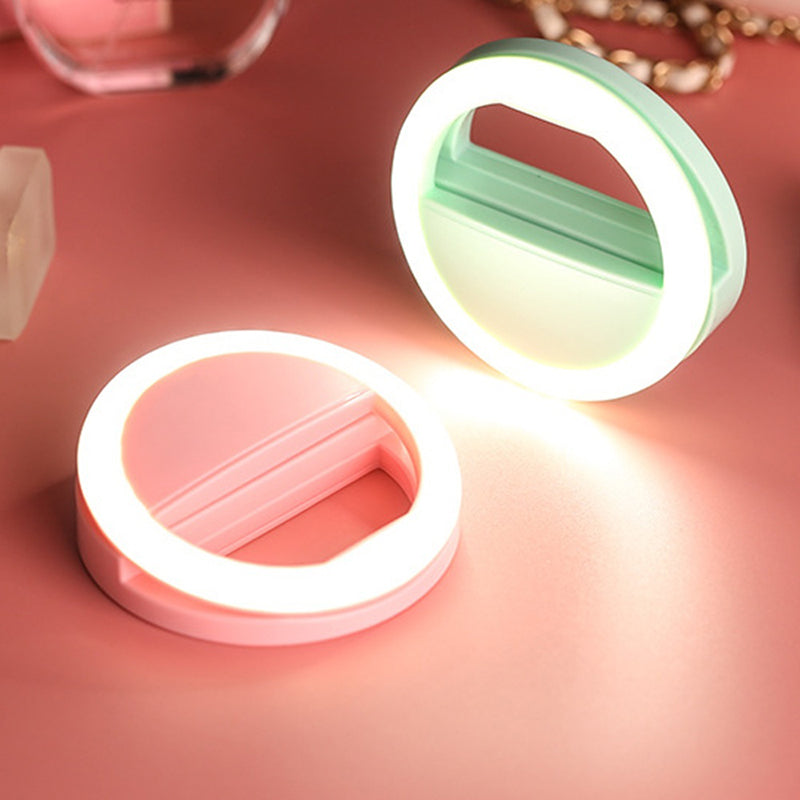 ForKumi pro selfie ring light in pink and green glowing on a pink surface