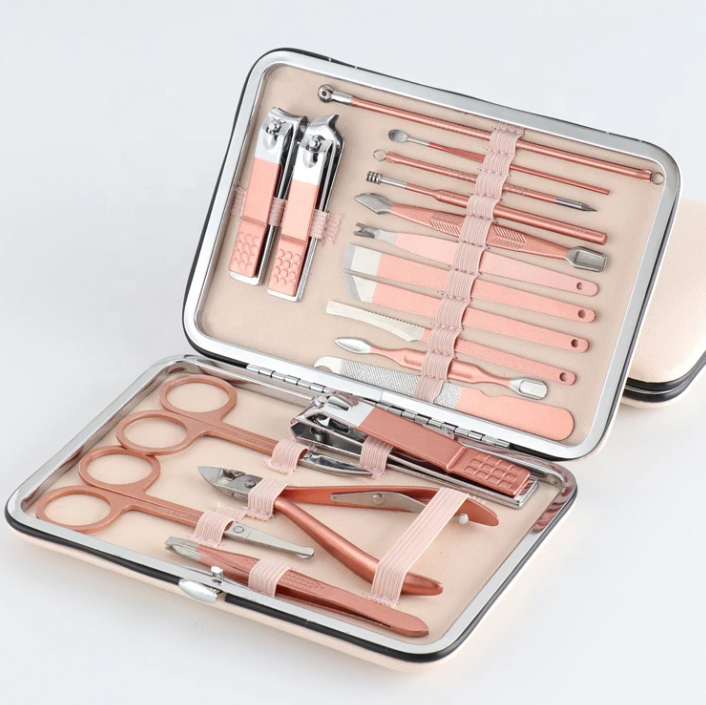 ForKumi professional manicure pedicure kit with rose gold tools in a compact metal case