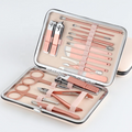 ForKumi professional manicure pedicure kit with rose gold tools in a compact metal case