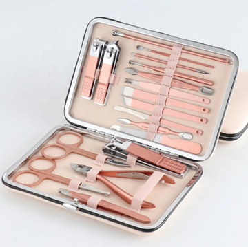 ForKumi professional manicure pedicure kit with rose gold tools in a compact metal case